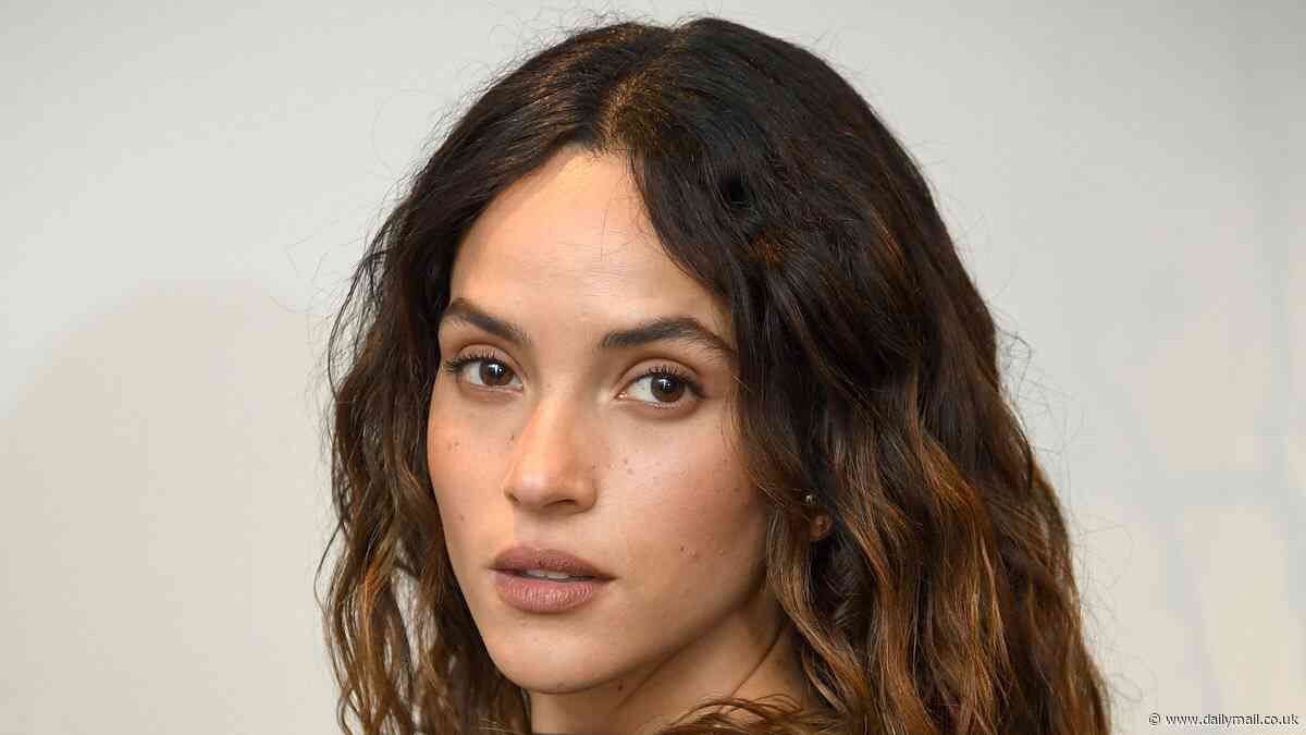 Adria Arjona looks radiant as she beams alongside Oscar Isaac for a screening of season two of Star Wars spin-off Andor