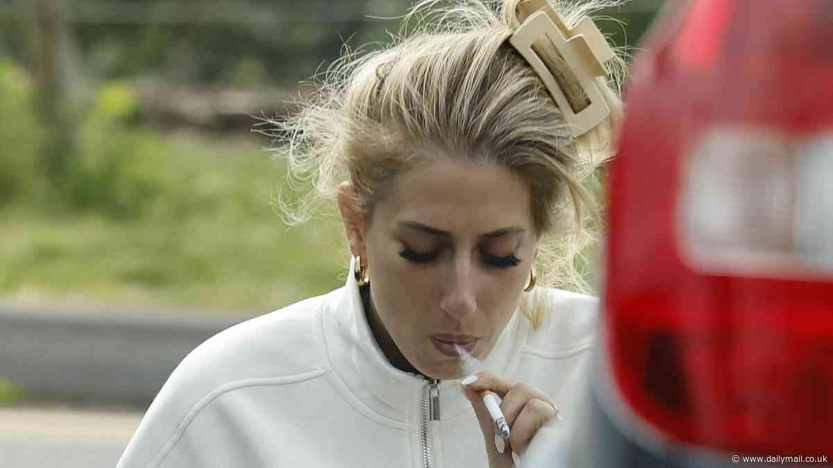 Stacey Solomon puffs on a cigarette by the side of the road as stressed-out star leaves local vet surgery in tears