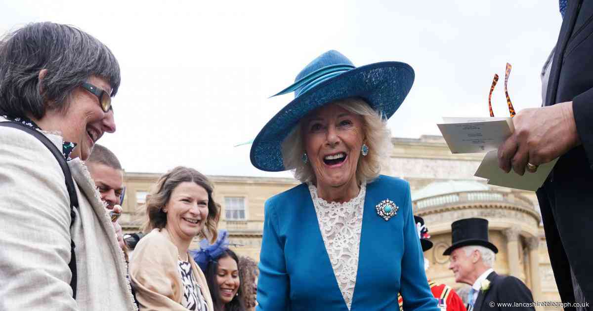 The Queen makes friends with an attention-hungry Lancs guide dog