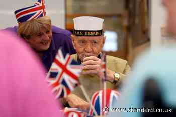 Veterans don Union flag hats and dance to 1940s tunes at VE Day street party