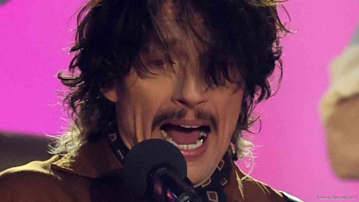 The Darkness' bizarre performance in VE Day concert leaves fans baffled as they question BBC's 'odd' choice to sign the rock band (and even Queen Camilla covers her ears!)