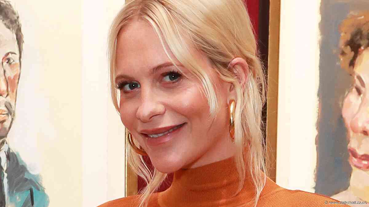 Pregnant Poppy Delevingne shows off her baby bump in a figure hugging orange dress as she attends Boy Dylan exhibition in London