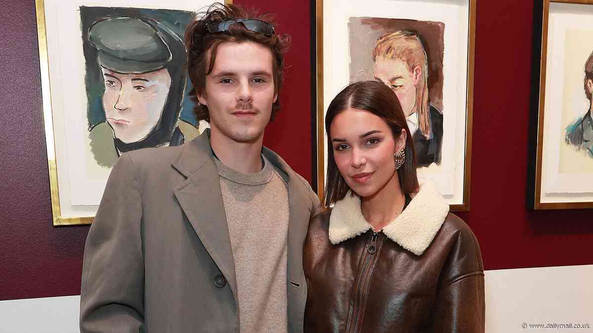 Cruz Beckham, 20, takes his mind off the 'family feud' as he enjoys a date night with girlfriend Jackie Apostel, 29, at Bob Dylan gallery in London