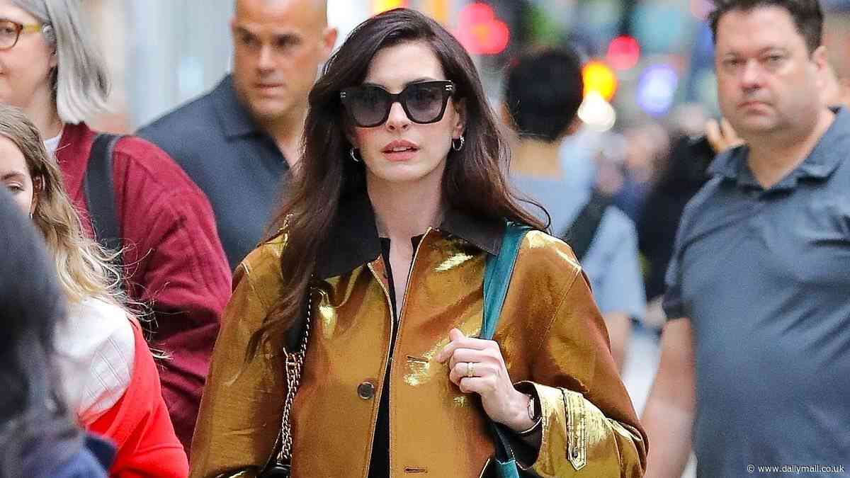 Anne Hathaway shows off wrinkle-free face in New York City after plastic surgery rumors