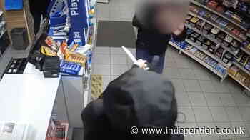 Shop worker confronts knife-wielding robber with bare hands after female colleague threatened
