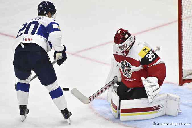 Czechs open their defense of hockey worlds title with 5-4 win over Switzerland