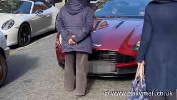 Moment furious woman walks into middle of the road in Mayfair to confront Aston Martin driver for revving too loudly