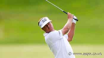 Mitchell retains lead through rainy day at Truist