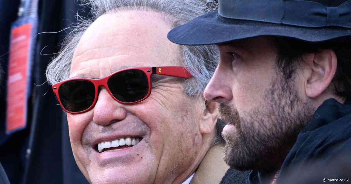 Hollywood legend smiles as he watches Victory Day military parade in Moscow
