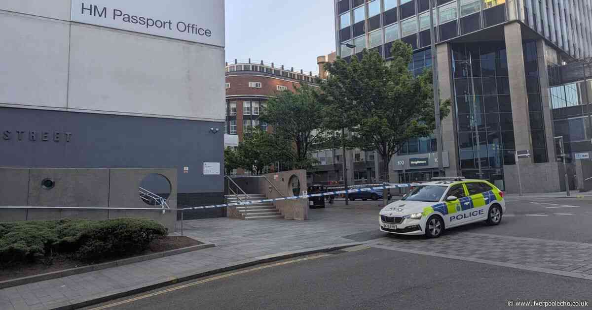Man in his 20s dies after being found outside passport office