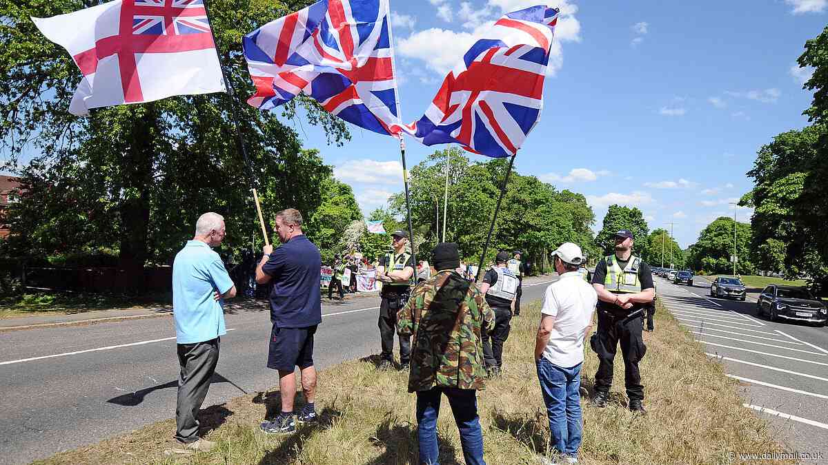 Anti-immigrant demonstrators stare down pro-migrant counter protesters outside asylum hotel