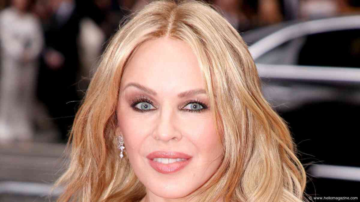 Kylie Minogue is ageless as she poses up a storm in waist-cinching jeans
