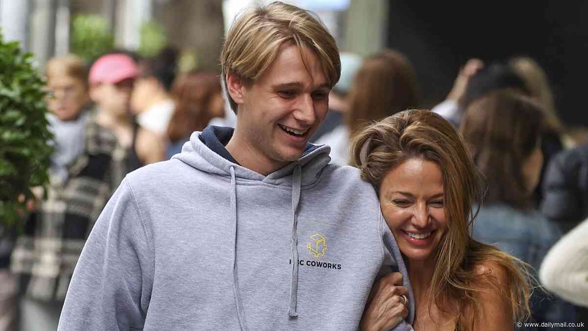 Nude artist Dina Broadhurst shows off her trim pins in a tiny skirt as she enjoys Mother's Day brunch with her son Leo in Sydney