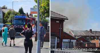 Firefighters scrambled to car blaze in back yard which spread to house