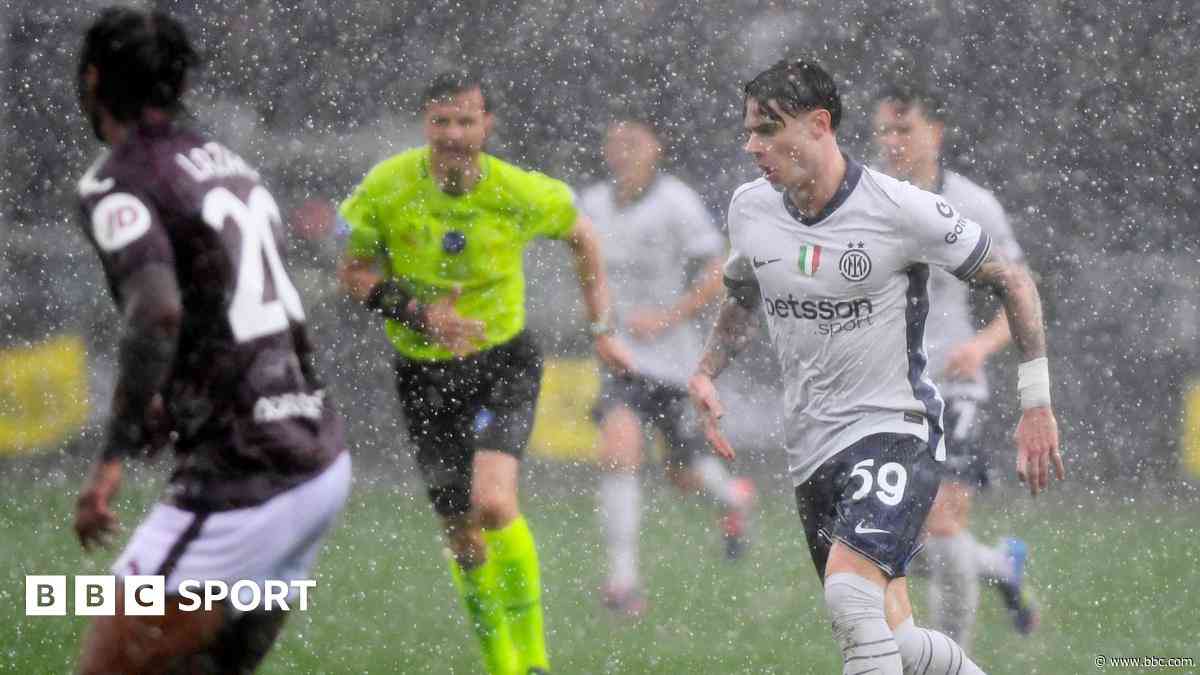 Inter win rain-delayed match to close gap on Napoli