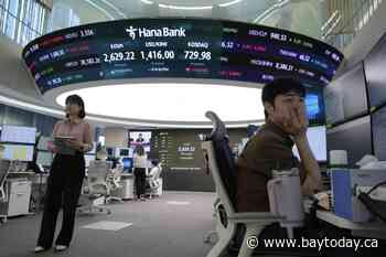 Asian shares mostly gain amid cautious relief over U.S.-China agreement