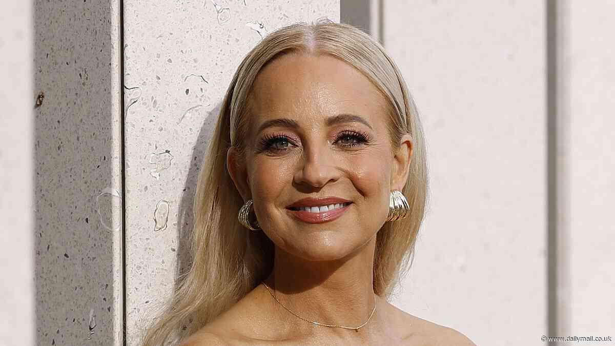 Glowing Carrie Bickmore, 44, looks incredibly youthful she stuns in a floral strapless top at the Aje show during Australian Fashion Week