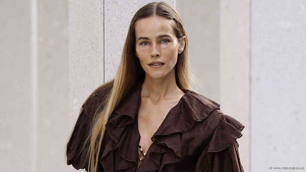 Home and Away star Isabel Lucas shows off slim figure in ethereal frock as she returns to spotlight at Australian Fashion Week following Covid vaccine drama