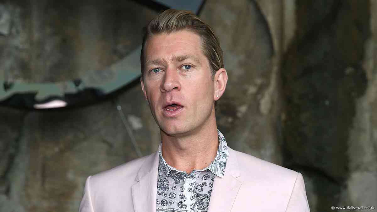 Ksubi designer Dan Single reveals he was 'dead for ten minutes' after fall from Paris hotel balcony as he makes shock return to limelight at Australian Fashion Week with racy art installation
