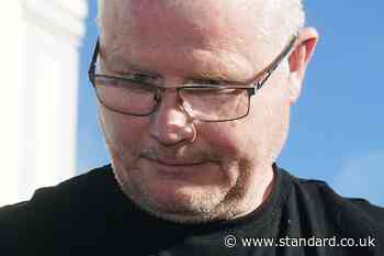 Murder accused cut dressing gown belt so he could hold dead wife, court hears