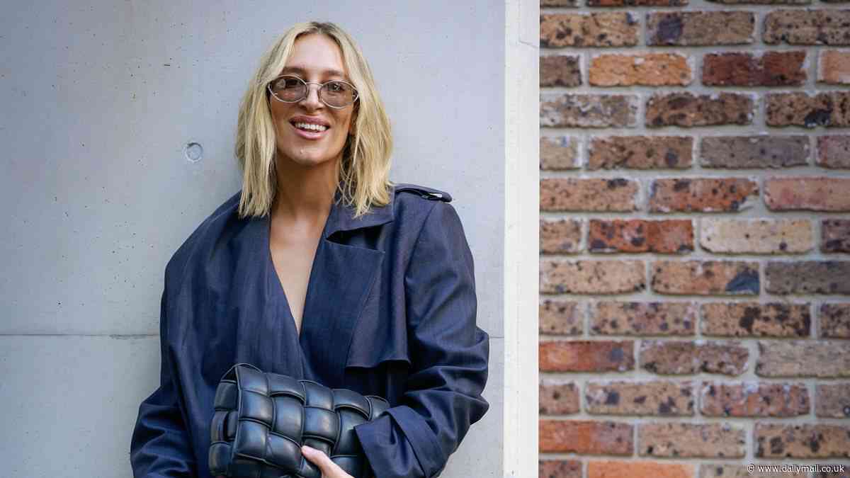 Phoebe Burgess opts for a demure look at Australian Fashion Week after stunning onlookers with bold lips and pyjama inspired ensemble
