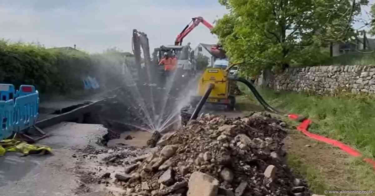Huge sinkhole suddenly emerges in Welsh road leaving locals without water