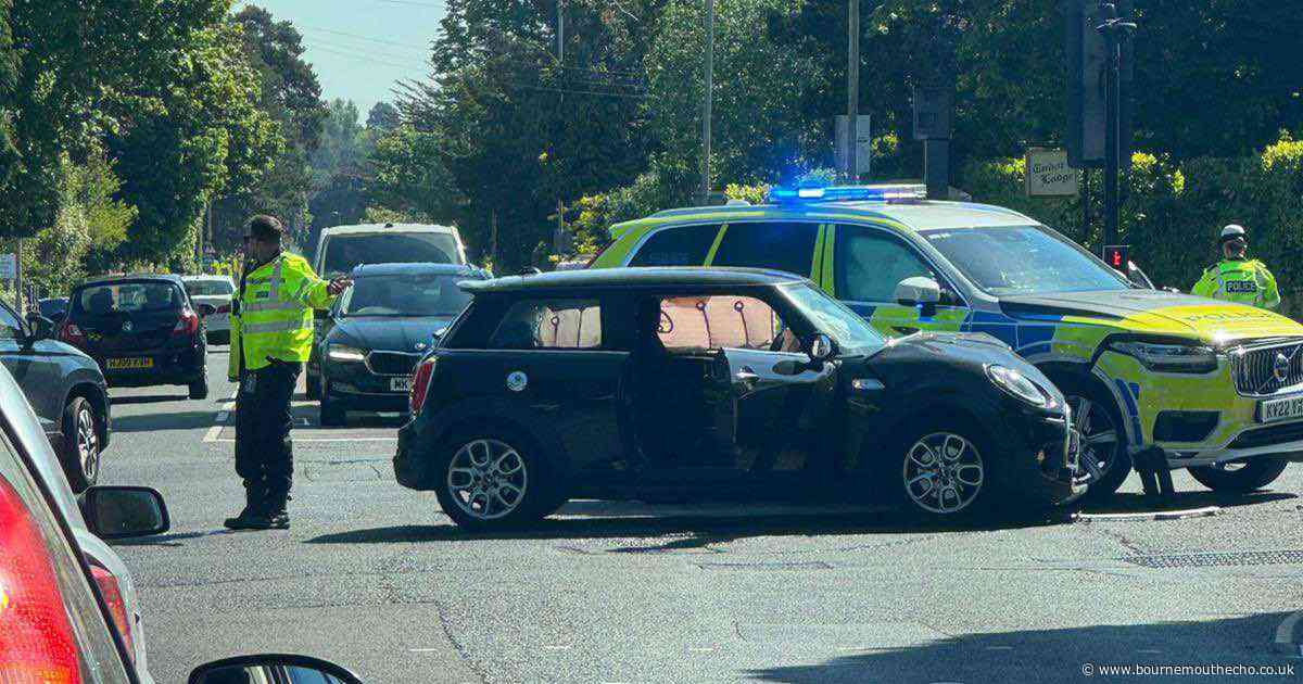 Crash involving police vehicle at Poole junction
