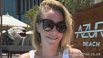 Laura Hamilton, 43, displays her incredible figure as she poses poolside while soaking in the sun at an upscale Dubai resort