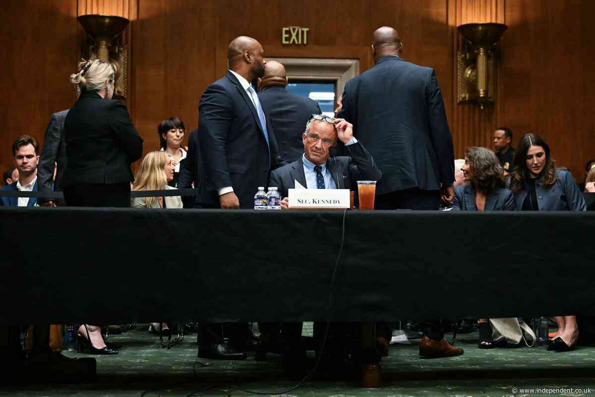 RFK Jr visibly startled by protesters amid angry confrontations over cuts and vaccines at health hearing