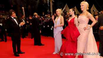Tom Cruise claps in awe of his co-stars Pom Klementieff, Hayley Atwell and Hannah Waddingham on the red carpet at his Mission: Impossible 8 premiere in Cannes - as new movie is SAVAGED by brutal film critics