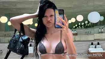 Naked Amelia Hamlin shocks with bathroom selfie exposing her thong bikini tan line