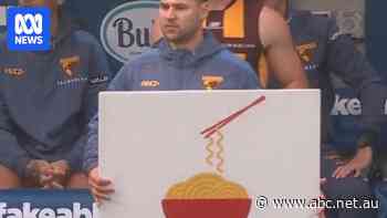 From noodles to 'WIN', the AFL has weird signs but the messages are crystal clear