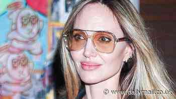 Angelina Jolie looks chic in a sheer black dress and heels as she visits her Atelier shop in NYC