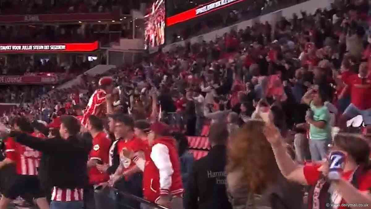 The incredible moment PSV fans discover Jordan Henderson's Ajax have CHOKED in the Dutch title race to 99th-minute equaliser