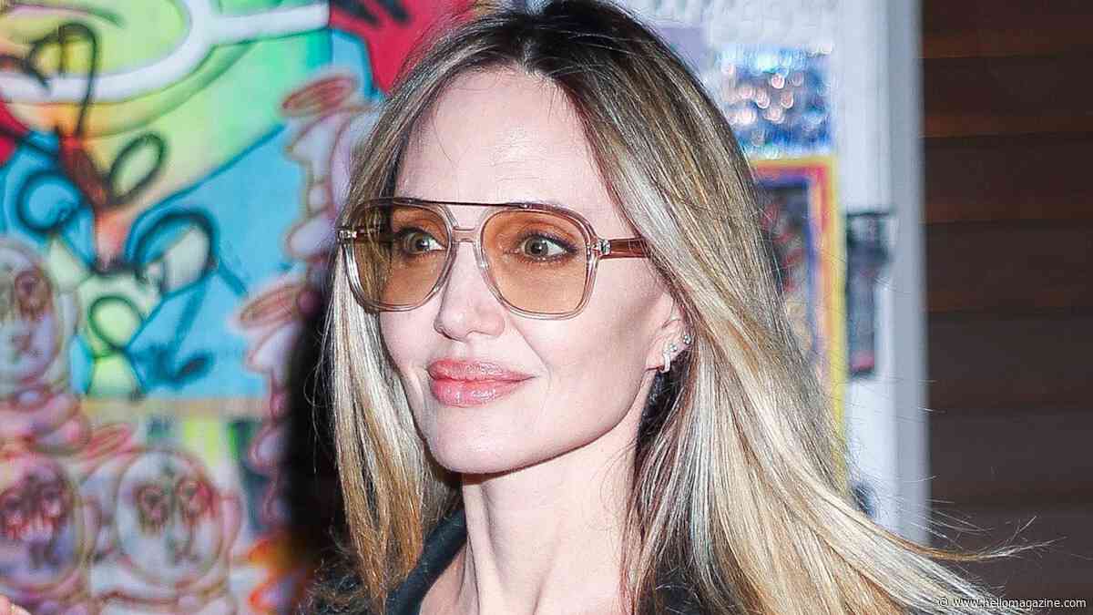 Angelina Jolie's sheer little black dress and sultry lace slip combo is the epitome of chic