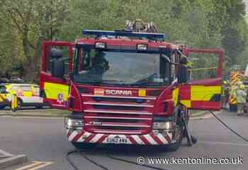 Neighbours told to keep windows and doors shut as firefighters battle garage blaze