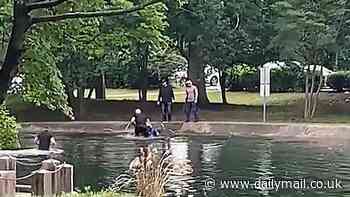 Wild moment migrant tries to escape ICE agents by jumping into pond outside courthouse