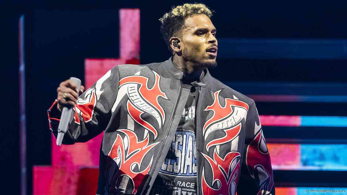 Chris Brown is charged with GBH after alleged bottle attack on music producer at London nightclub: US rapper is thrown in cells after being arrested at five-star hotel and will appear in court later today