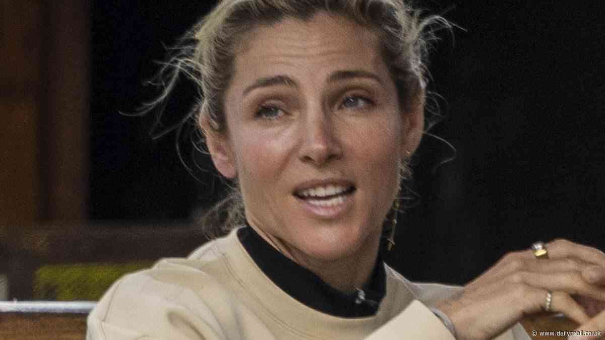 Elsa Pataky goes barefoot and bare faced in Byron Bay as she catches up with a friend for matcha at a cafe wearing tiny sports shorts