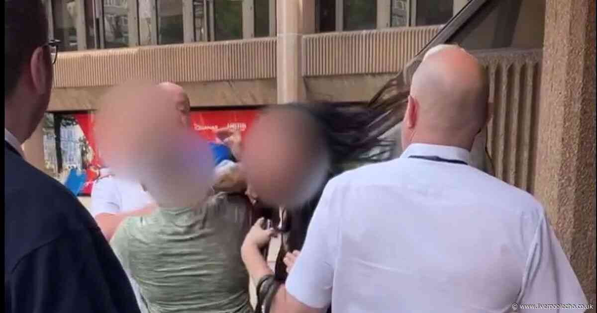 Women brawl outside court with one ragged by the hair as staff try to stop them