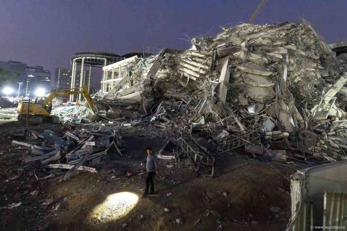 Thai construction magnate surrenders on felony negligence charges over building collapse in quake