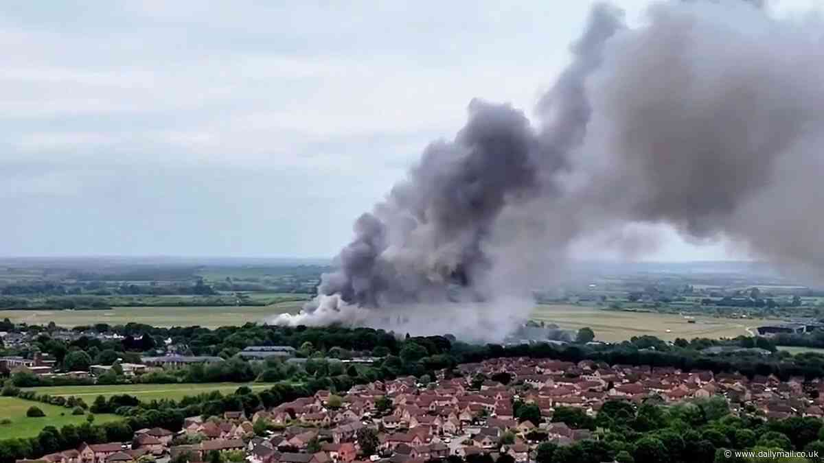 Bicester fire: Multiple explosions heard as blaze rips through former RAF base - with smoke seen for miles as police boss describes 'awful situation'
