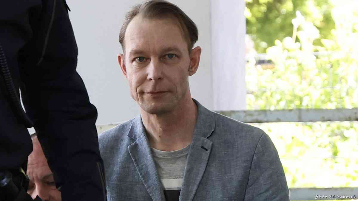 Chilling moment Madeleine McCann suspect Christian Brueckner SMIRKS as he is asked: 'Did you kill Maddie?'