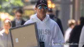Moving in? Sutton Foster leaves Hugh Jackman's New York apartment as he carries in boxes and belongings
