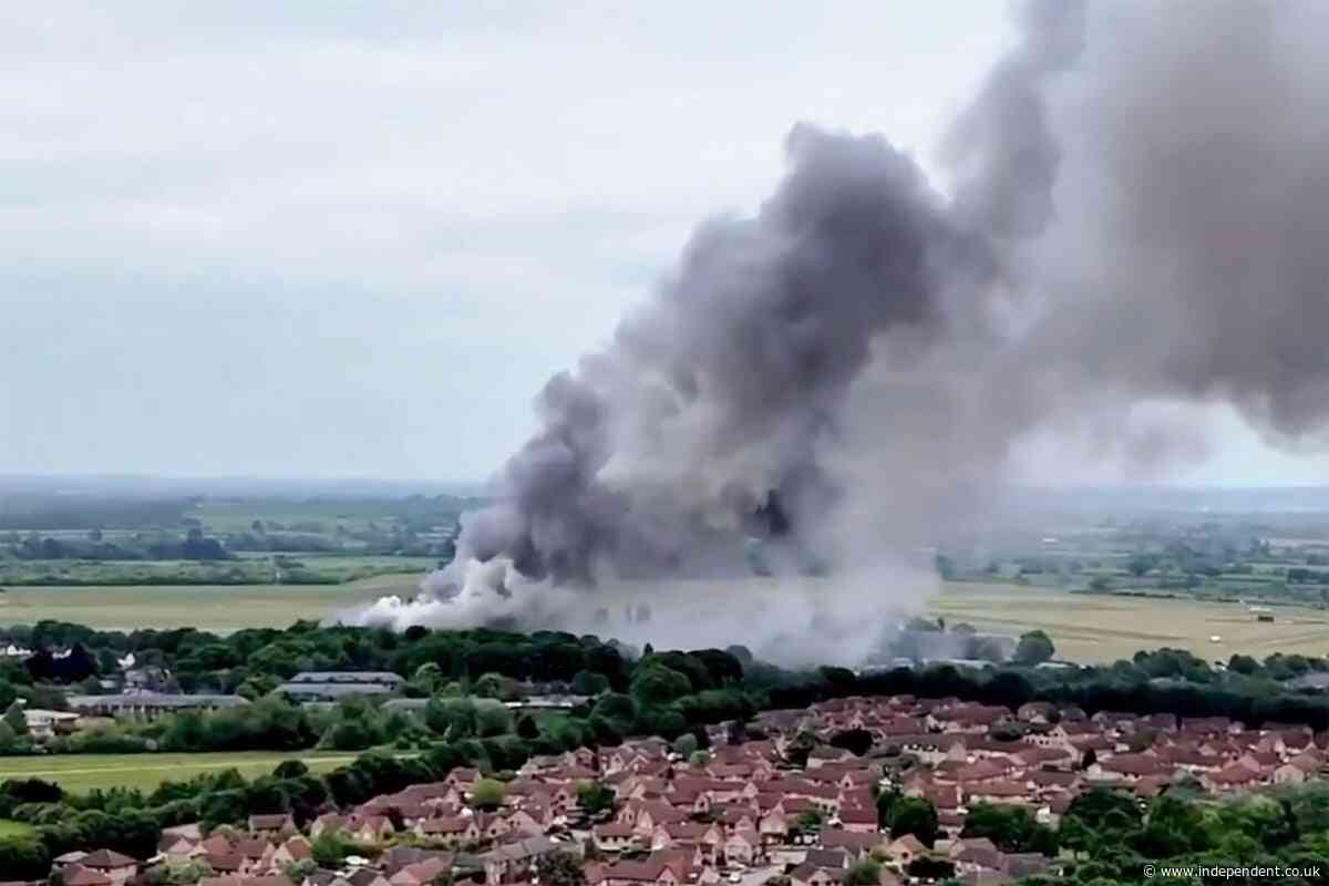 Two firefighters and member of public dead after large fire at ex-RAF base