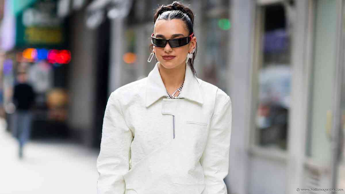 Dua Lipa dazzles in lace-up corset shirt and capri pants 