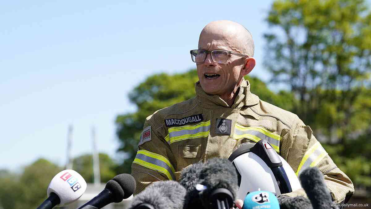Fire chief chokes with emotion as he tells of 'heavy heart' after death of two brave colleagues in Bicester heritage car centre blaze as two more are treated in hospital following inferno
