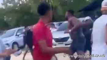 Shocking moment British tourist is attacked by crowd wielding makeshift weapons after getting into a fight with a taxi driver in Bali