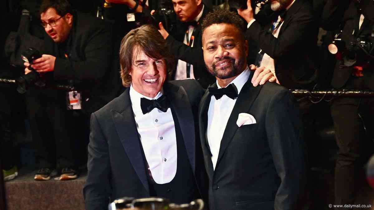 Tom Cruise reunites with his Jerry Maguire co-star Cuba Gooding Jr. on the Cannes red carpet