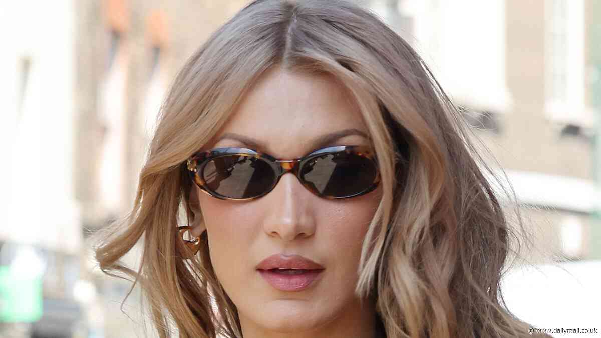 Supermodel Bella Hadid heads to famous budget fried chicken shop in London's Brick Lane after wowing on the Cannes red carpet